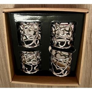 NIB Michael Aram set four metallic napkin rings designed hearts.